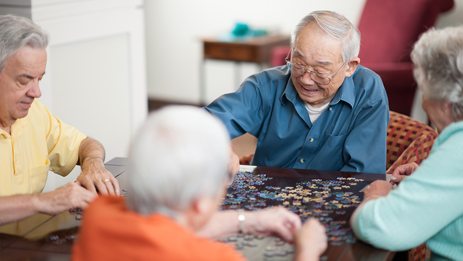 seniors assembling puzzle