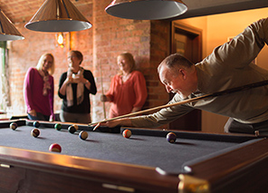 residents playing a game of pool