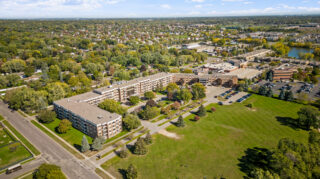 Aerial view of Apple Valley Village senior living community with surrounding neighborhood..