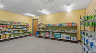 Convenience store with snacks, beverages, and essentials at Apple Valley Village.