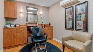 Salon with styling chair and sink area at Apple Valley Village.