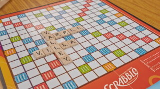 Scrabble board game on table in activity space at Apple Valley Village.